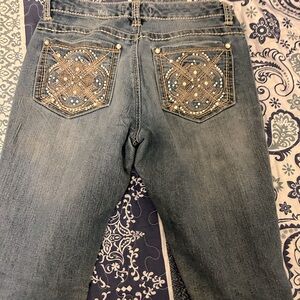 Women’s Jeans. Just some wear on the bottoms. Says size two but fits size 4-8.